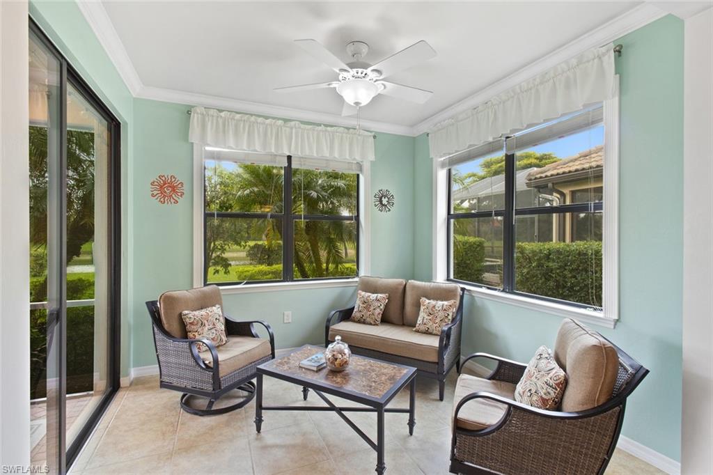6085 Triumph Lane Ave Maria, FL 34142 - Photo 4 of 42 a living room with furniture and a large window