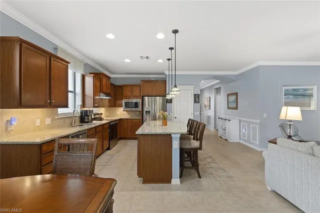 a large kitchen with lots of counter space and windows