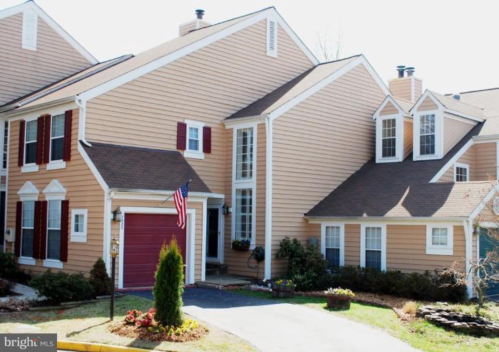 1532 Deer Point Way Reston, VA 20194 - Photo 1 of 19 a front view of a house with a yard