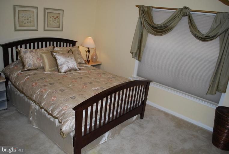 1532 Deer Point Way Reston, VA 20194 - Photo 13 of 19 a bedroom with a bed and a window