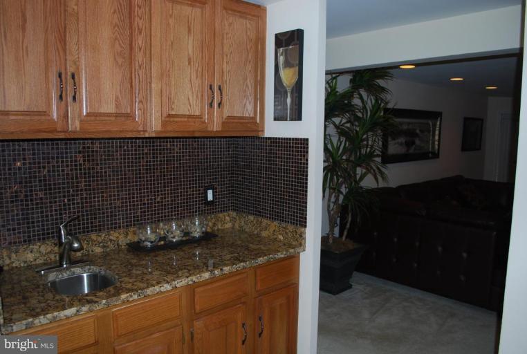 1532 Deer Point Way Reston, VA 20194 - Photo 16 of 19 a kitchen with a sink and cabinets