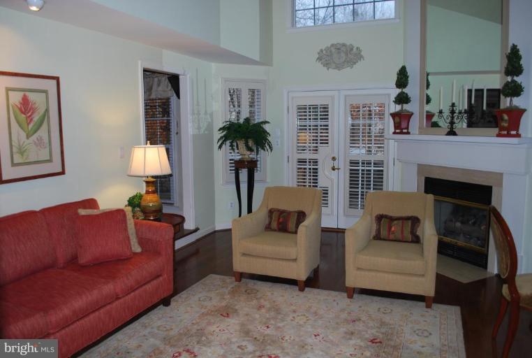 1532 Deer Point Way Reston, VA 20194 - Photo 3 of 19 a living room with furniture and a fireplace