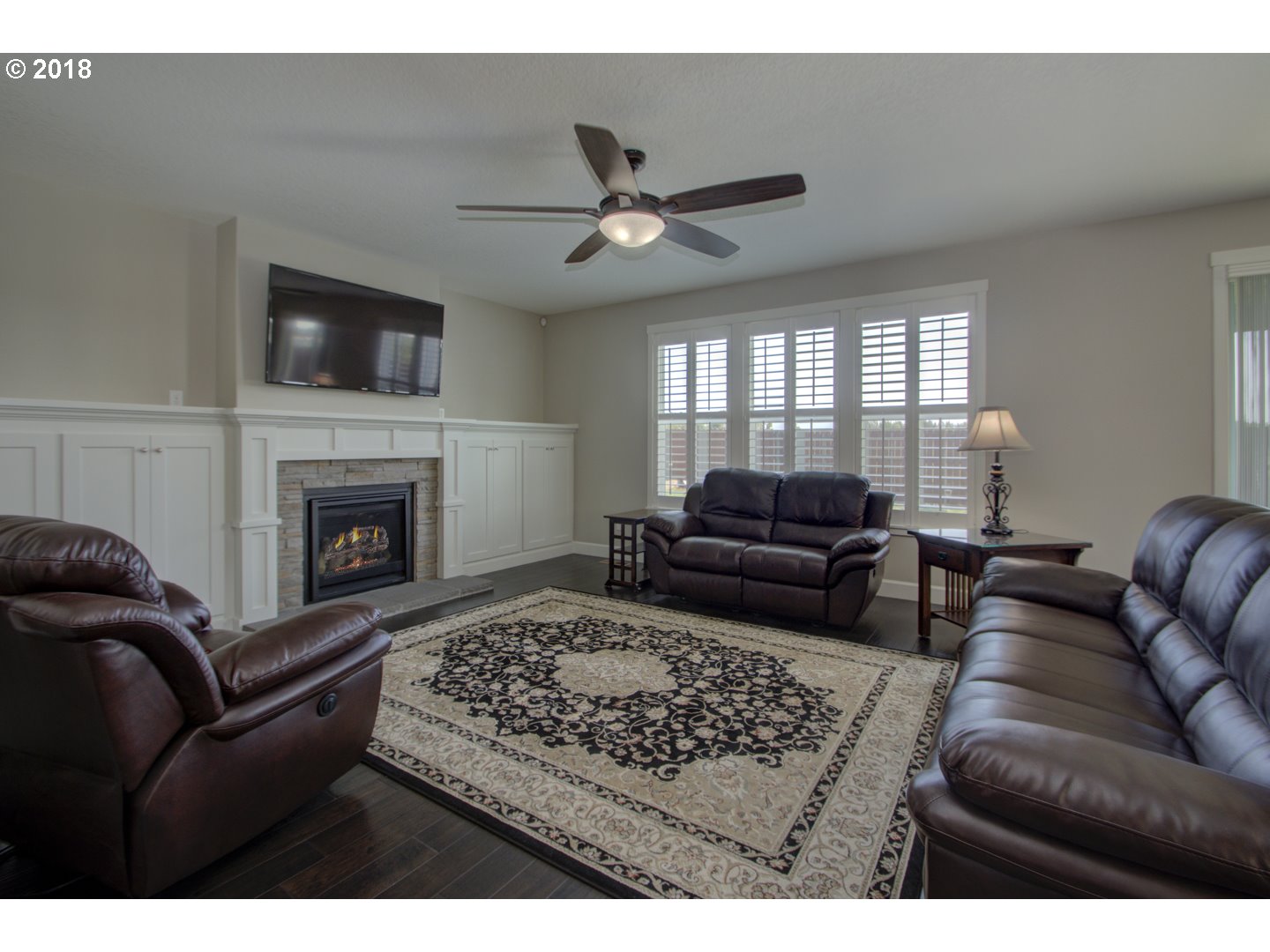 4821 North 6th Street Ridgefield, WA 98642 - Photo 10 of 29 a living room with furniture and a fireplace