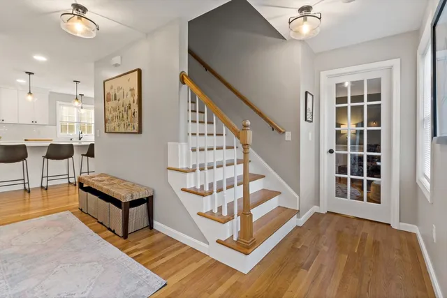 a view of a livingroom with furniture and stairs