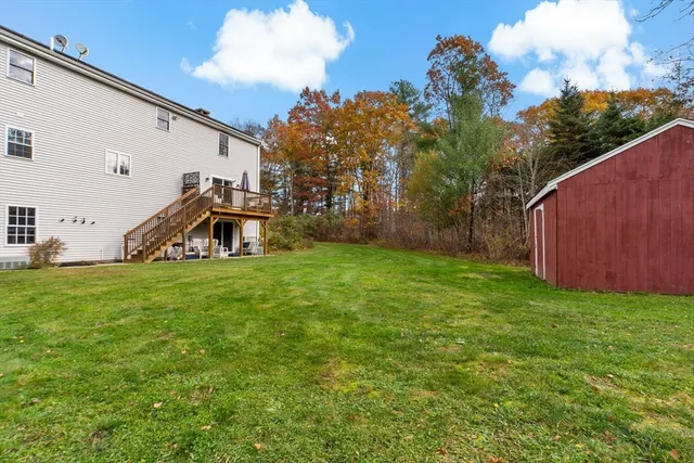 a view of a back yard of the house