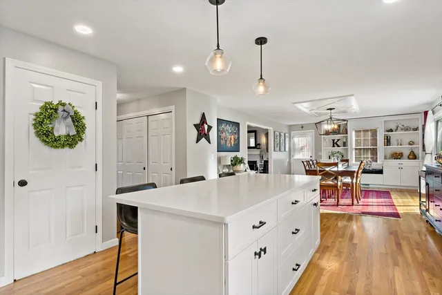 a view of a living room and a wooden floor