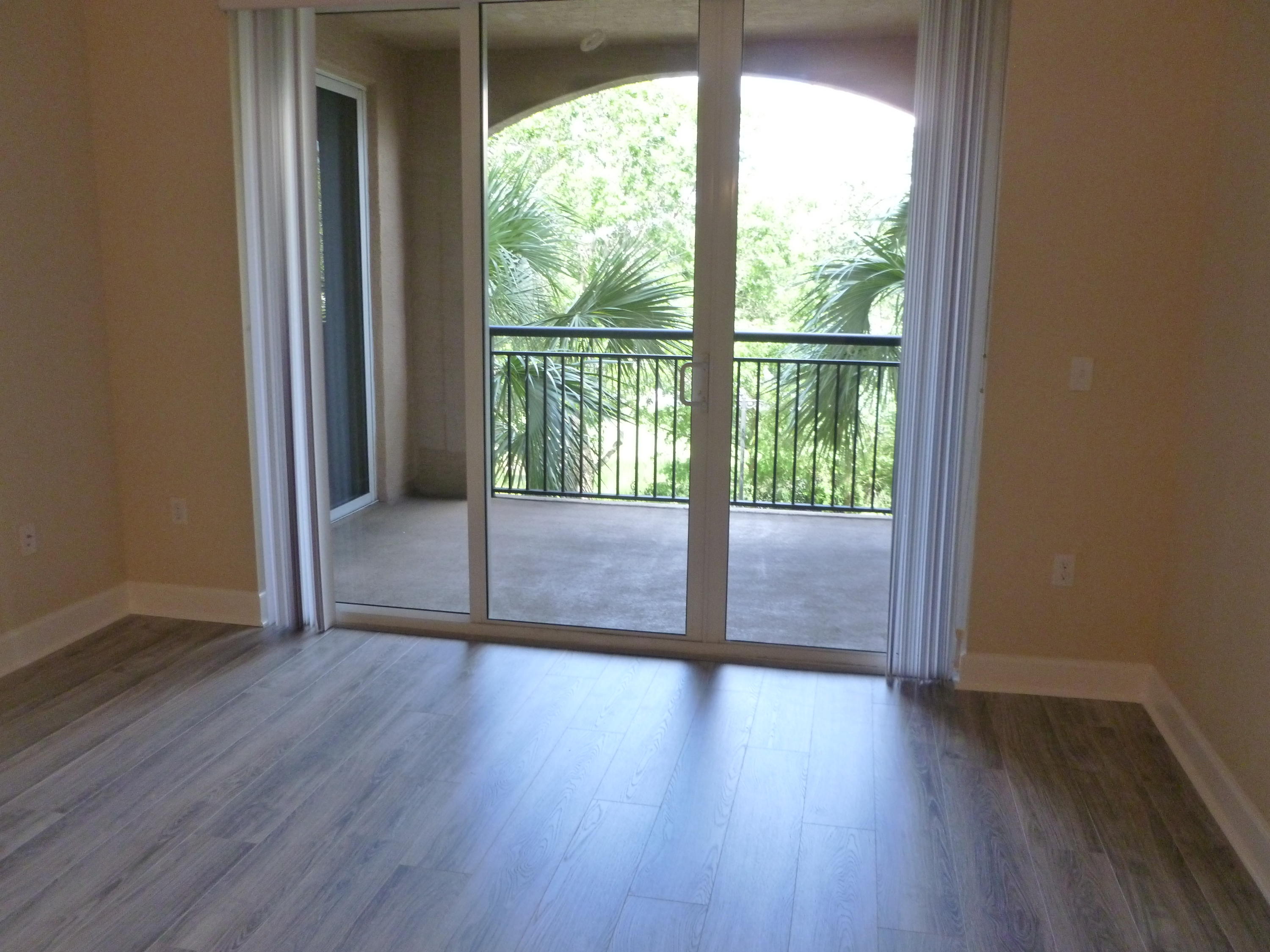 1690 Renaissance Commons Boulevard, Unit 1315 Boynton Beach, FL 33426 - Photo 6 of 39 Livingroom /Patio