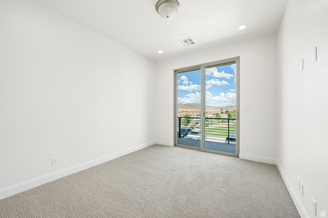 684 West High Tide Place, Unit 131 St. George, UT 84790 - Photo 9 of 27 Expansive sliding glass doors provide broad natural light and mountain scenery