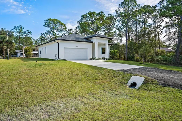 a house with yard in front of it