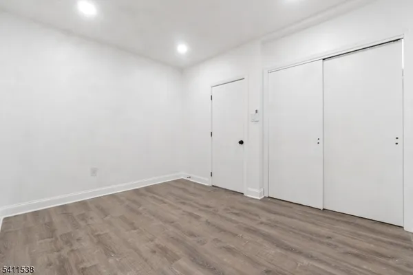 an empty room with wooden floor