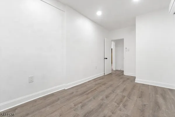 a view of room with hardwood floor