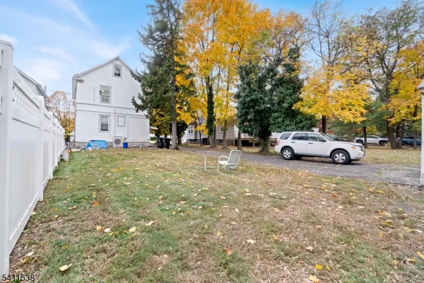 a view of a car parked in front of a house