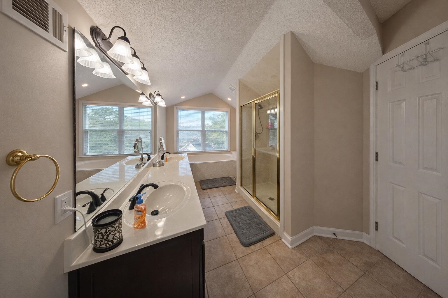30 Point Grand Court Savannah, TN 38372 - Photo 11 of 40 a bathroom with a sink mirror and vanity