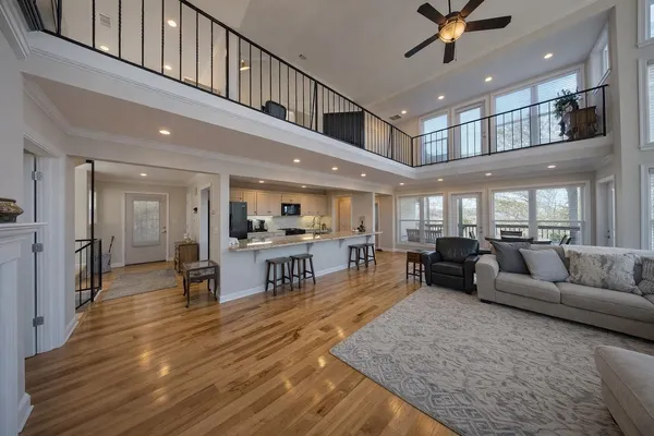 a view of balcony with furniture and wooden fence