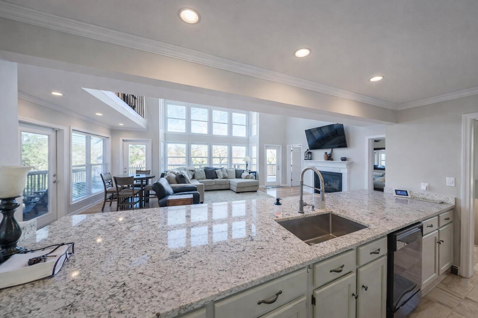30 Point Grand Court Savannah, TN 38372 - Photo 30 of 40 a kitchen with granite countertop a sink counter top space and living room view