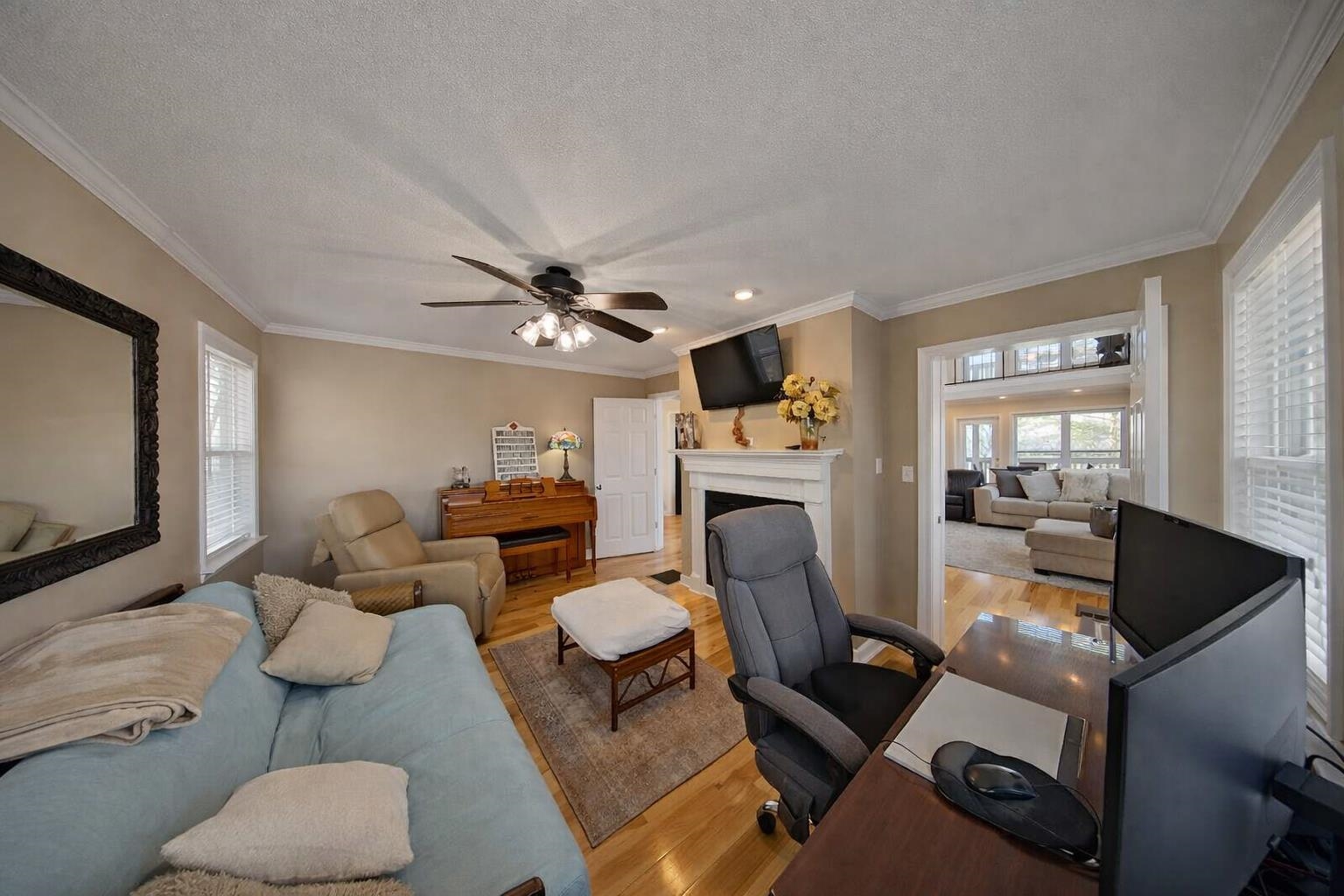 30 Point Grand Court Savannah, TN 38372 - Photo 32 of 40 a living room with furniture a fireplace and a flat screen tv