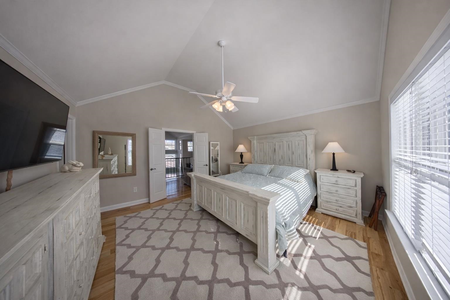 30 Point Grand Court Savannah, TN 38372 - Photo 10 of 40 a spacious bedroom with a bed and a flat screen tv