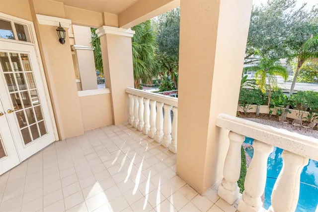 a view of a balcony with wooden floor and outdoor space