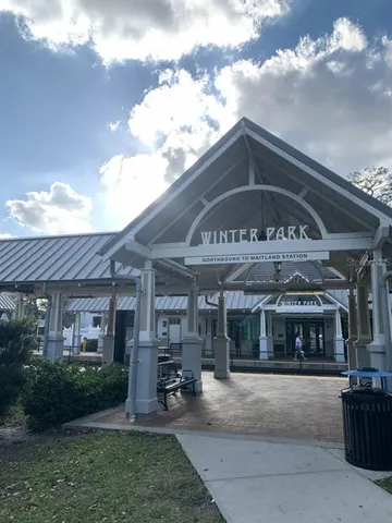 a view of a cafe with sitting area