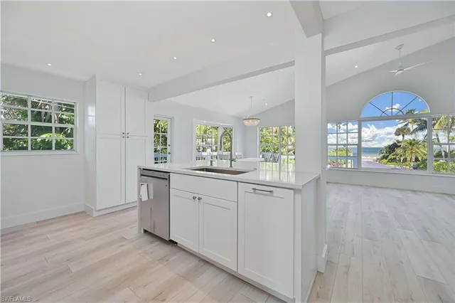 a view of a livingroom with a staircase and a fireplace