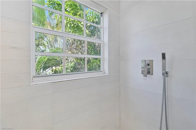 a view of a balcony with wooden floor
