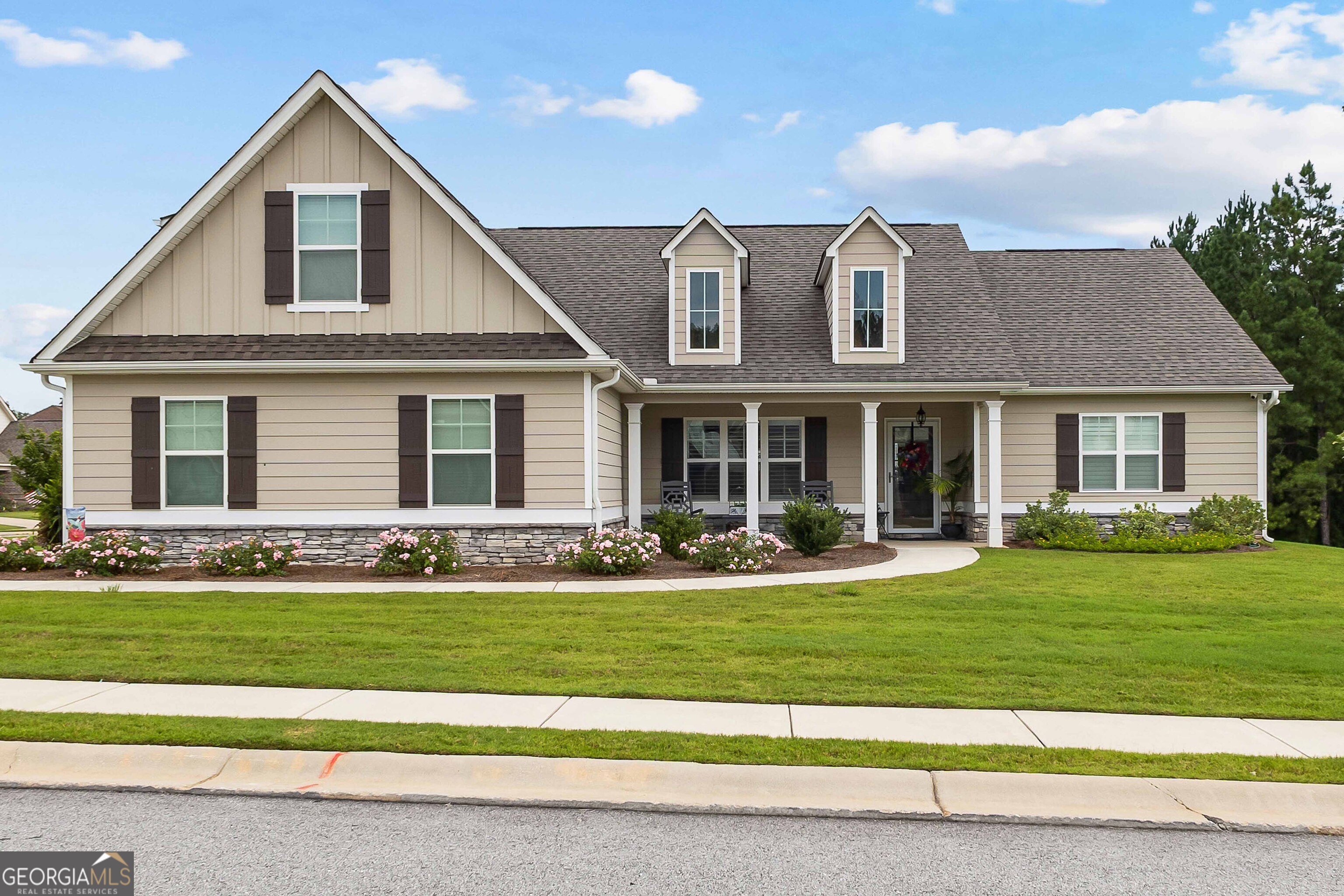 a front view of a house with a yard