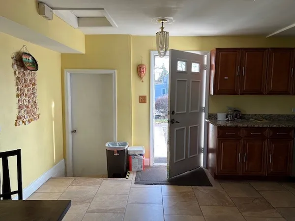 a kitchen with a refrigerator and a sink