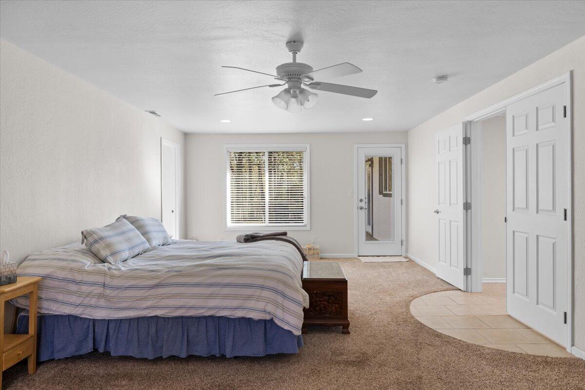 324 China Gulch Road Jacksonville, OR 97530 - Photo 21 of 45 a bedroom with a bed and window