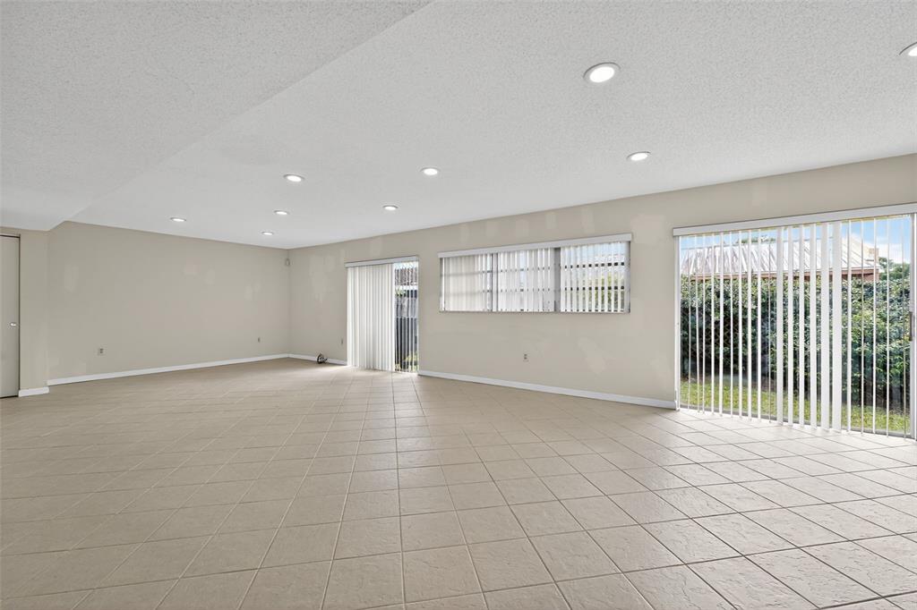 11530 Southwest 83rd Terrace Miami, FL 33173 - Photo 15 of 33 a view of an empty room with a window