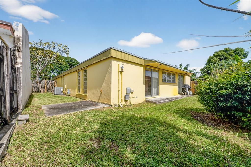 11530 Southwest 83rd Terrace Miami, FL 33173 - Photo 5 of 33 a view of a house with backyard and garden