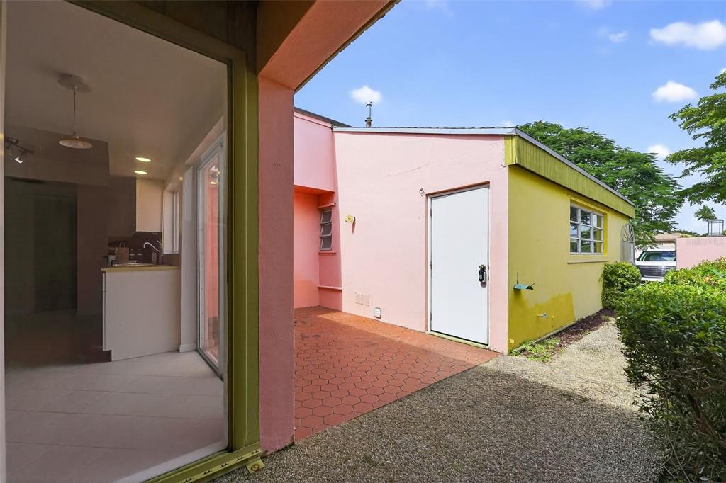 11530 Southwest 83rd Terrace Miami, FL 33173 - Photo 7 of 33 a front view of a house with a yard