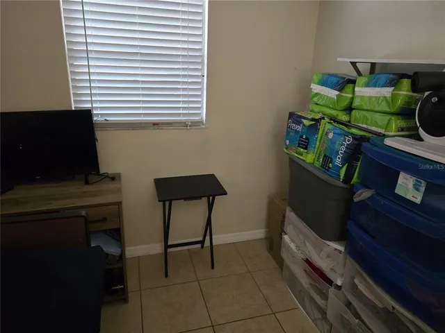 a view of room with window and furniture