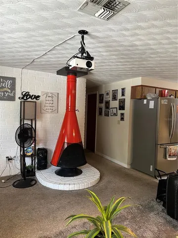 a room with gym equipment and a table