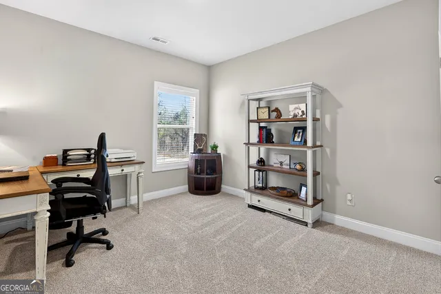 a workspace with furniture and window