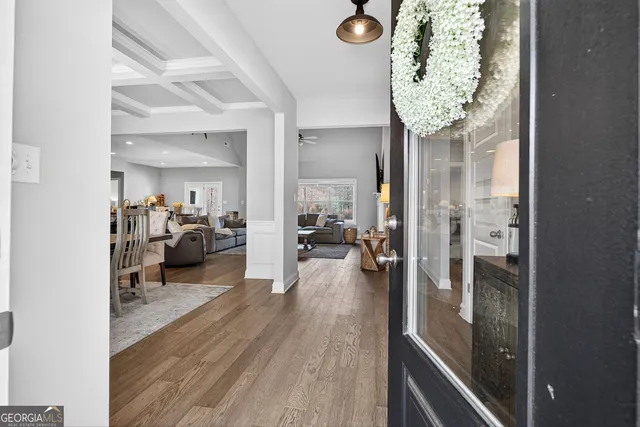 a very nice looking room with a large mirror and a chandelier