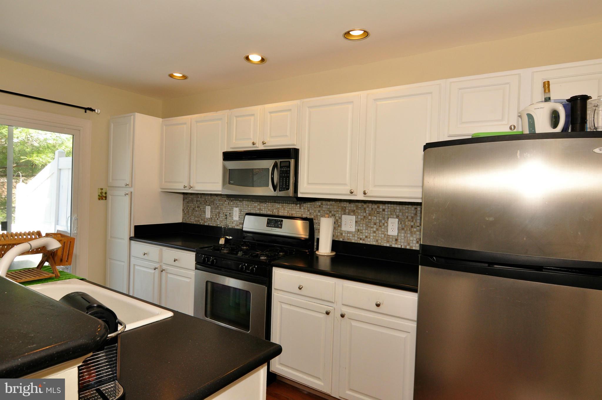 12095 Edgemere Circle Reston, VA 20190 - Photo 15 of 28 a kitchen with a sink appliances and cabinets