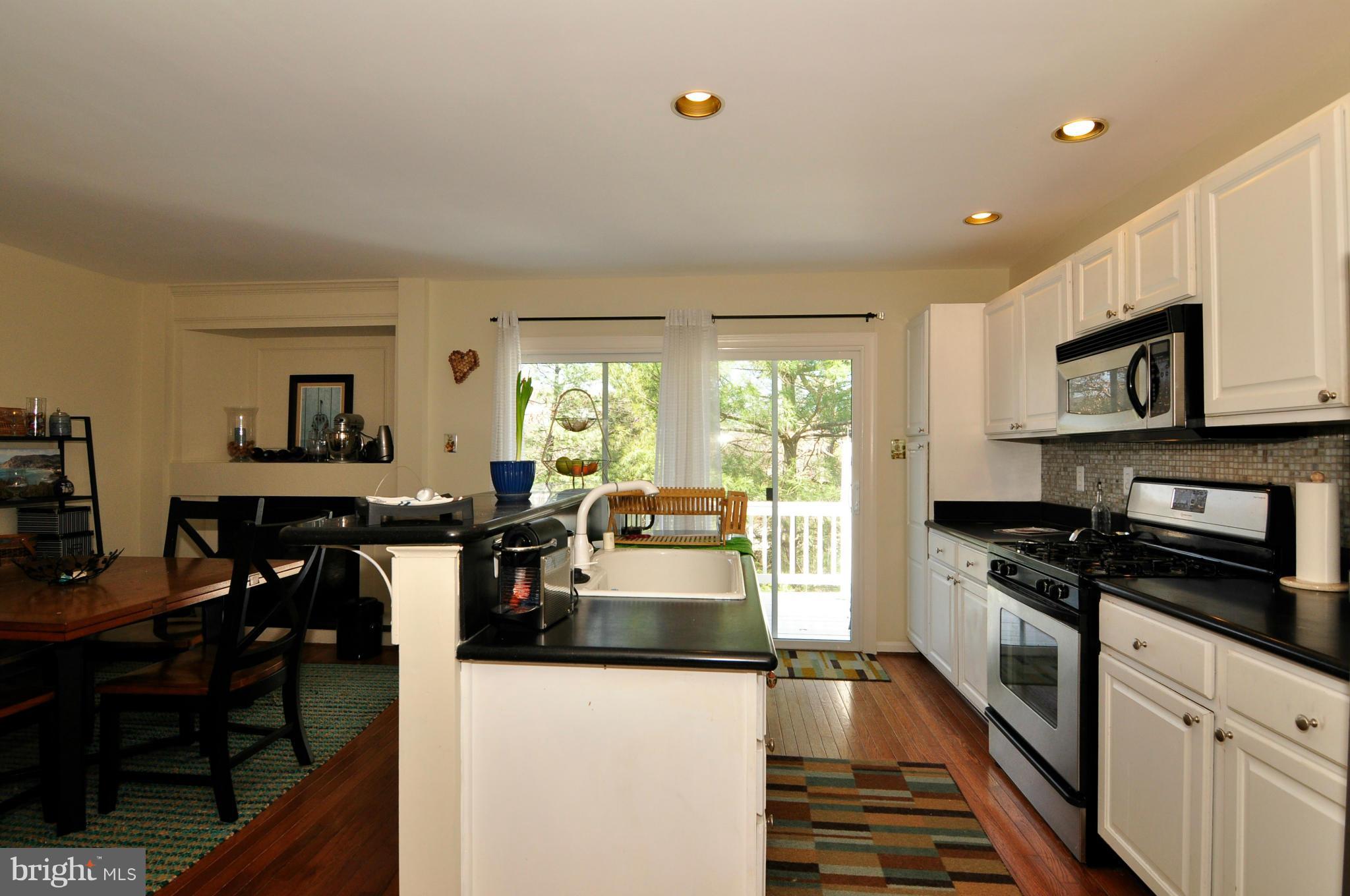 12095 Edgemere Circle Reston, VA 20190 - Photo 16 of 28 a kitchen with a stove a sink and a refrigerator