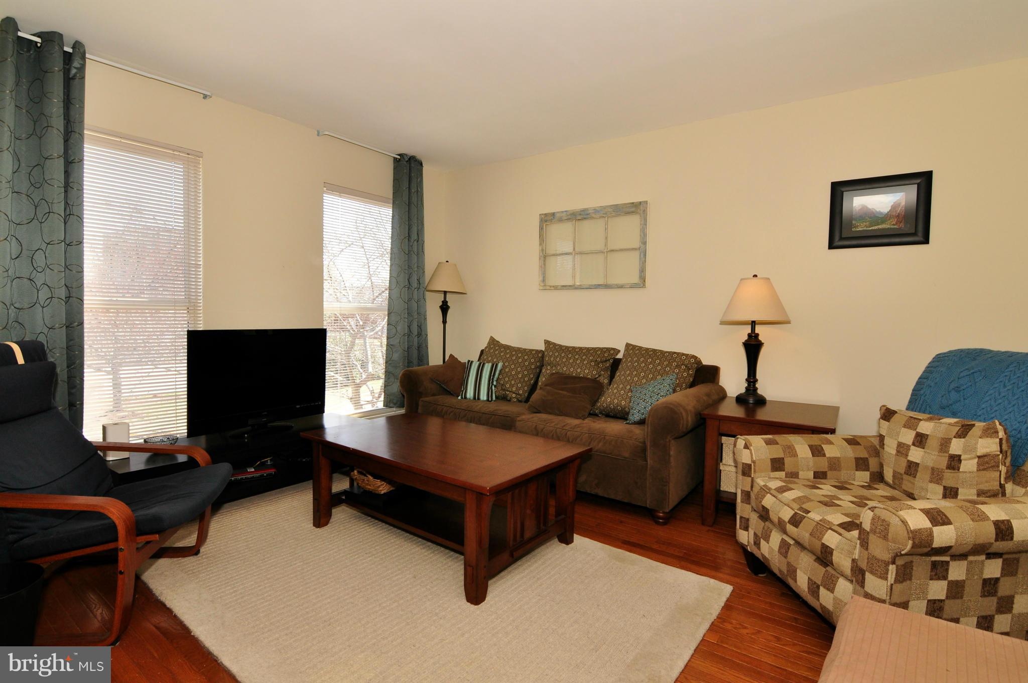 12095 Edgemere Circle Reston, VA 20190 - Photo 17 of 28 a living room with furniture and a flat screen tv