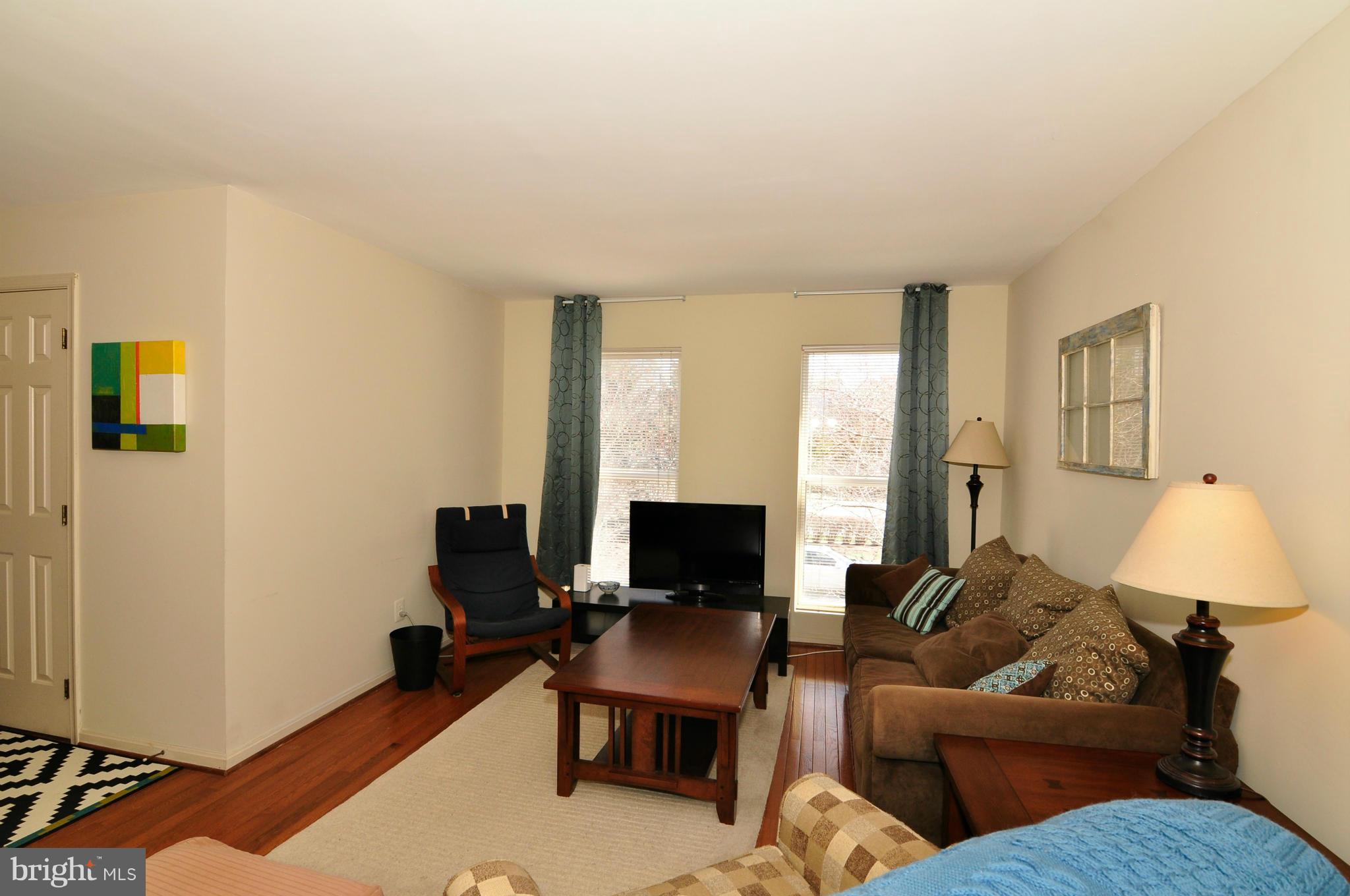 12095 Edgemere Circle Reston, VA 20190 - Photo 19 of 28 a living room with furniture and a flat screen tv
