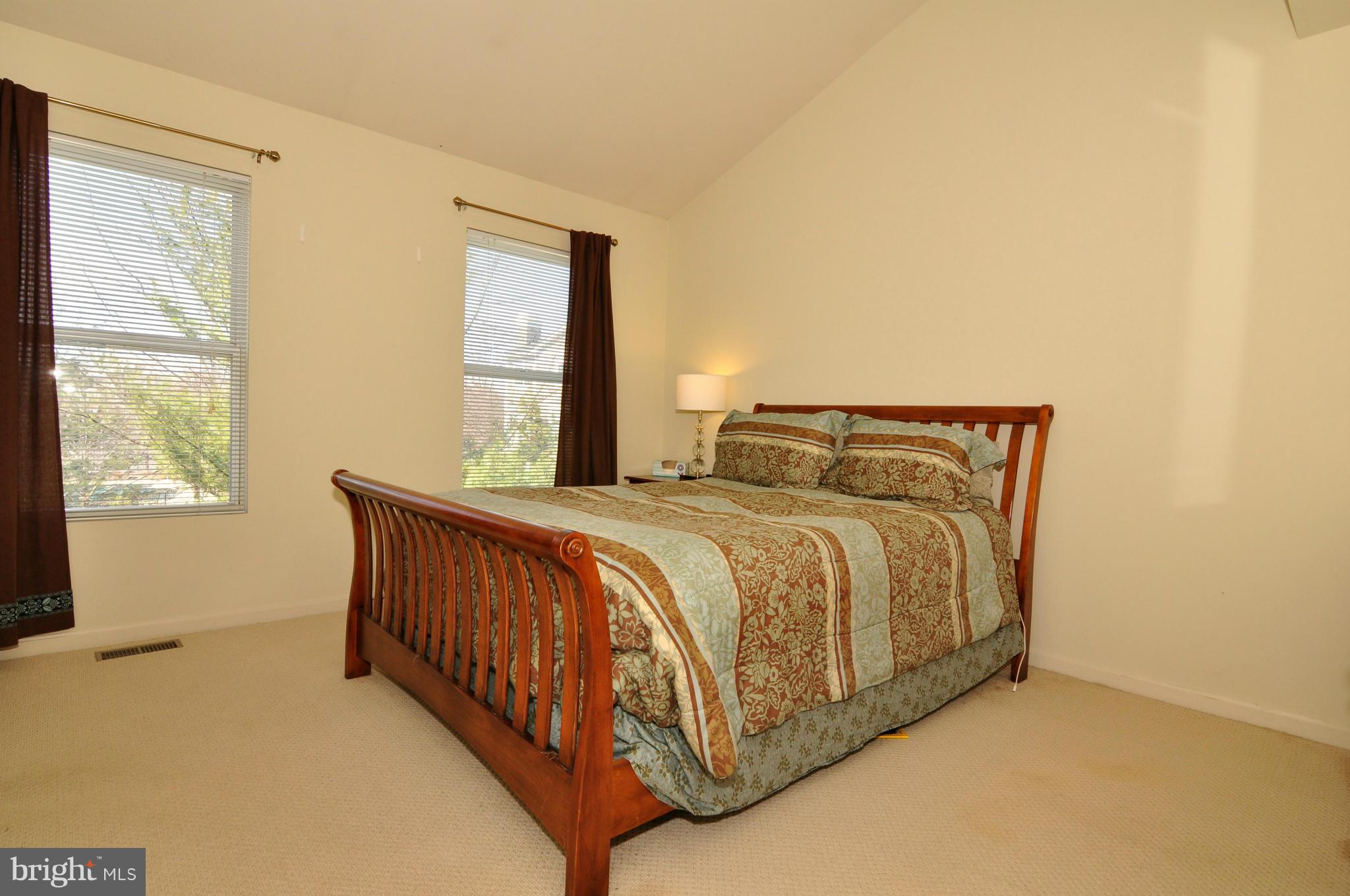 12095 Edgemere Circle Reston, VA 20190 - Photo 24 of 28 a bedroom with a bed and window
