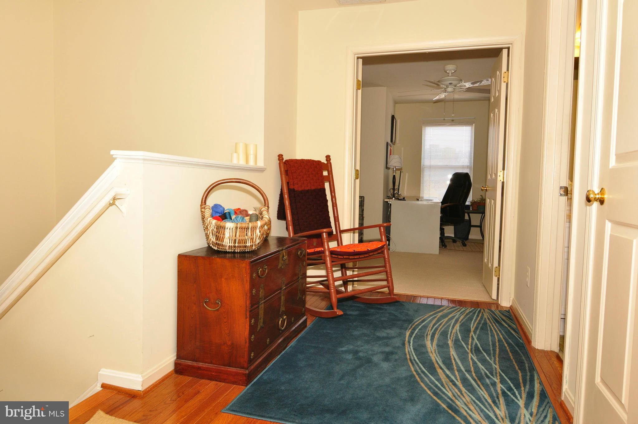 12095 Edgemere Circle Reston, VA 20190 - Photo 28 of 28 a living room with furniture and a wooden floor