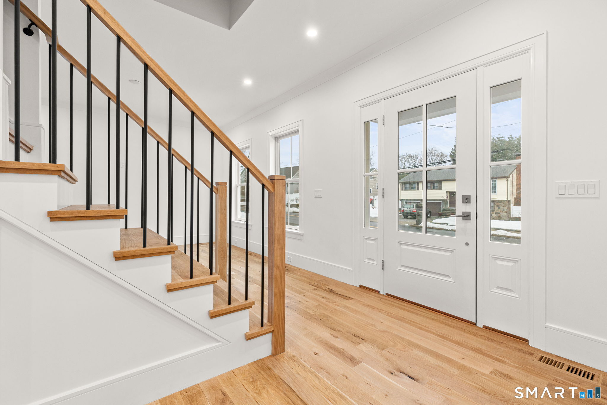 210 Pansy Road Fairfield, CT 06824 - Photo 15 of 26 a view of an entryway with wooden floor