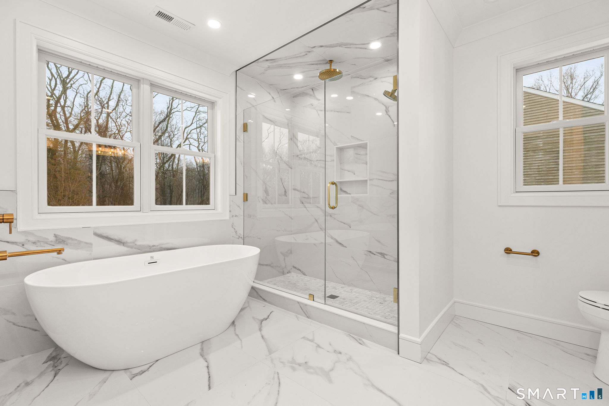 210 Pansy Road Fairfield, CT 06824 - Photo 17 of 26 a bathroom with a bathtub and shower