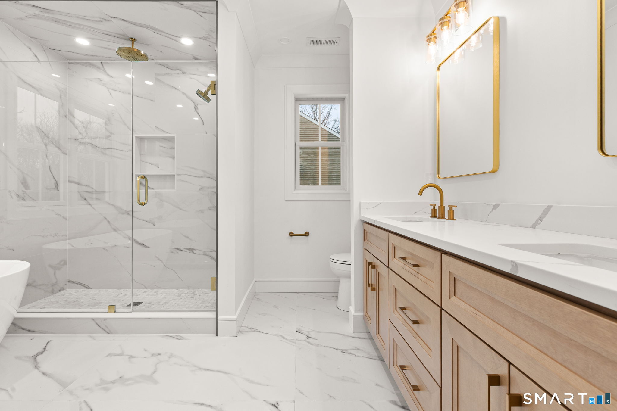 210 Pansy Road Fairfield, CT 06824 - Photo 19 of 26 a bathroom with a double sink shower and a mirror