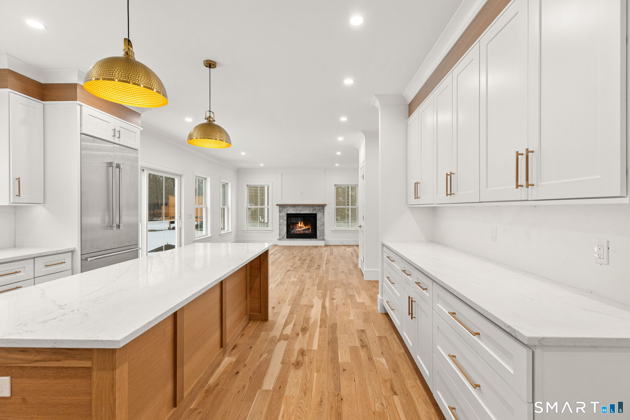 210 Pansy Road Fairfield, CT 06824 - Photo 5 of 26 a large kitchen with stainless steel appliances kitchen island granite countertop a sink and cabinets