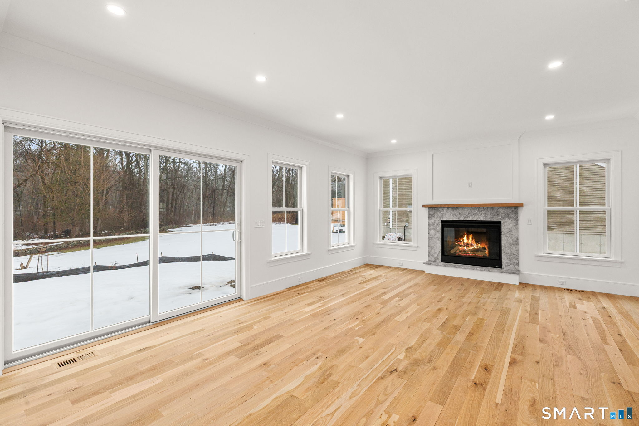 210 Pansy Road Fairfield, CT 06824 - Photo 8 of 26 a view of empty room with a fireplace and window