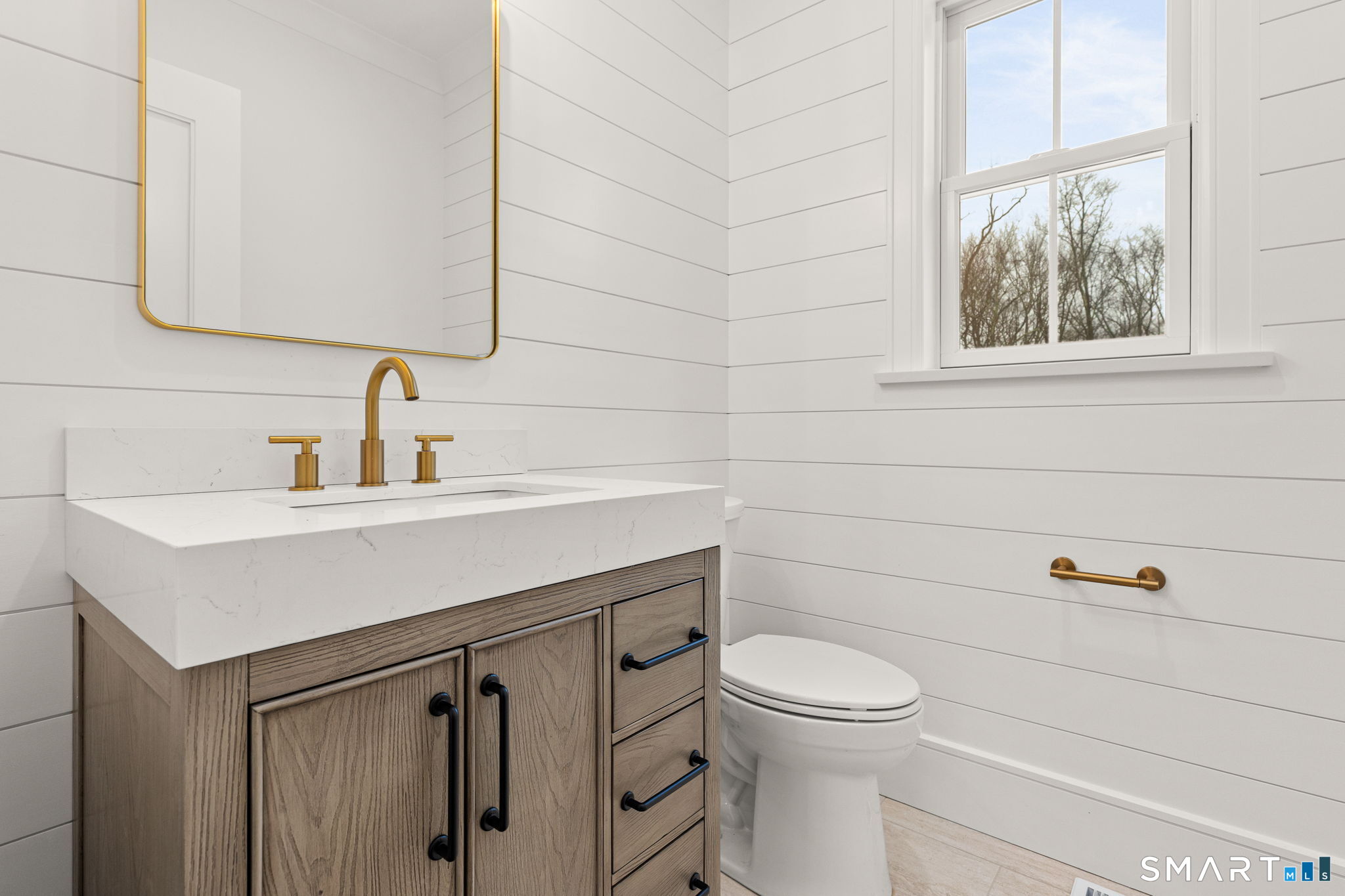 210 Pansy Road Fairfield, CT 06824 - Photo 9 of 26 a bathroom with a toilet sink and mirror