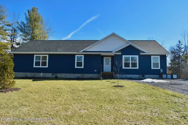 a house that has a lot of trees in it