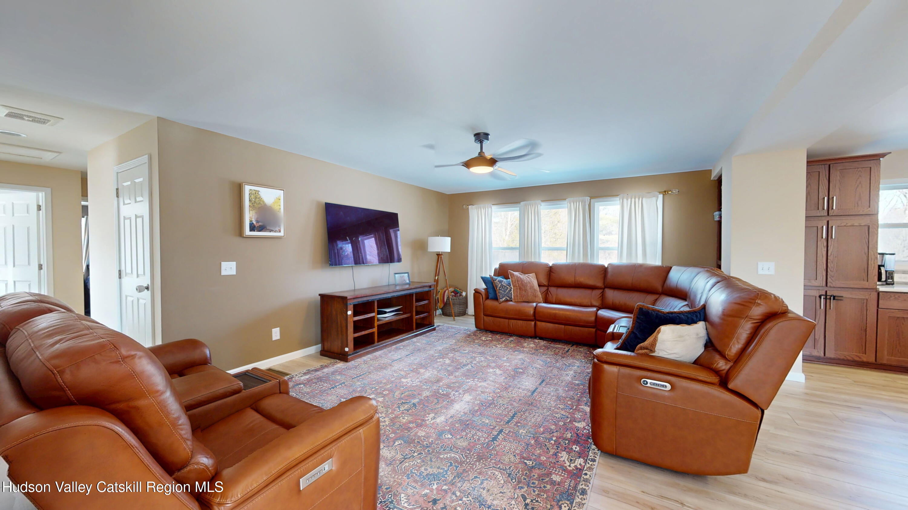 1608 Sleepy Hollow Road Athens, NY 12015 - Photo 12 of 46 a living room with furniture and a flat screen tv