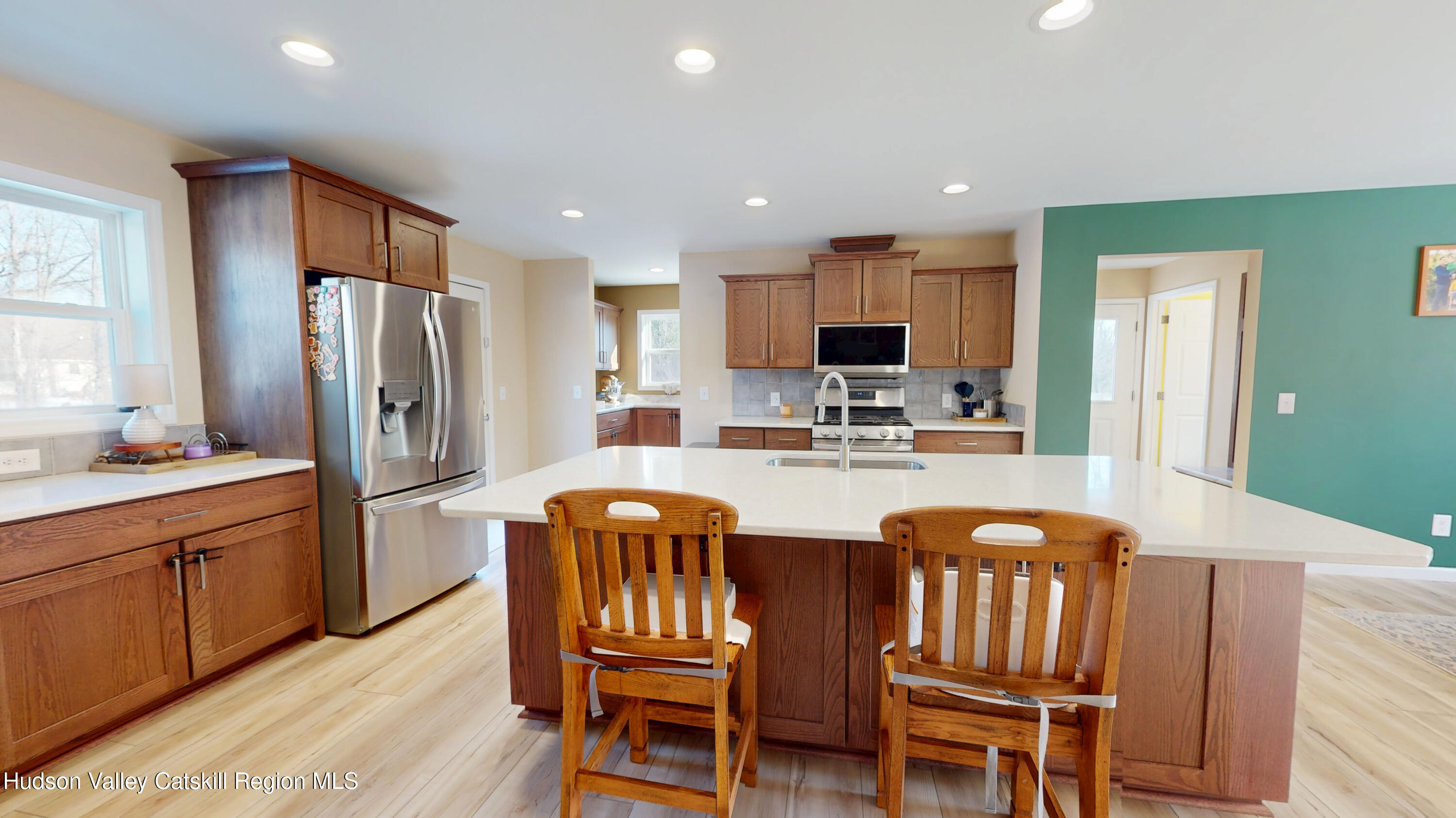 1608 Sleepy Hollow Road Athens, NY 12015 - Photo 2 of 46 a kitchen with stainless steel appliances a dining table chairs and refrigerator